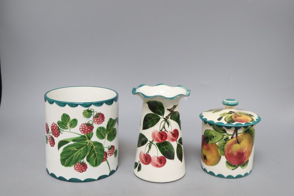 A Wemyss lidded jam pot, a vase decorated with strawberries and another fluted vase decorated with cherries, fluted vase, H13.5cm